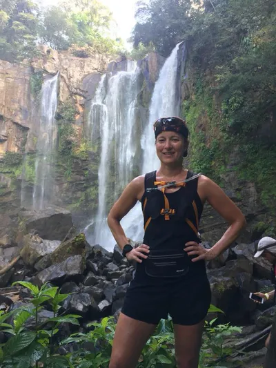 Woman by a waterfall