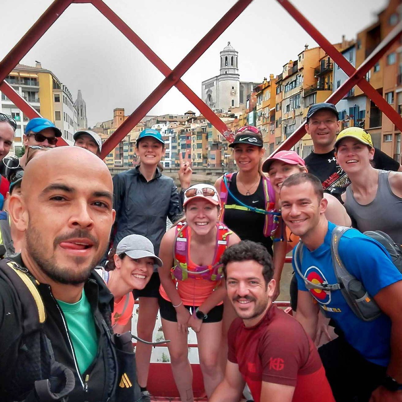 Running vacations group in the Girona bridge with the Cathedral on the back