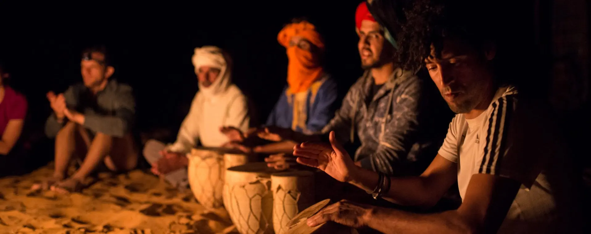 runners playing music in the sahara